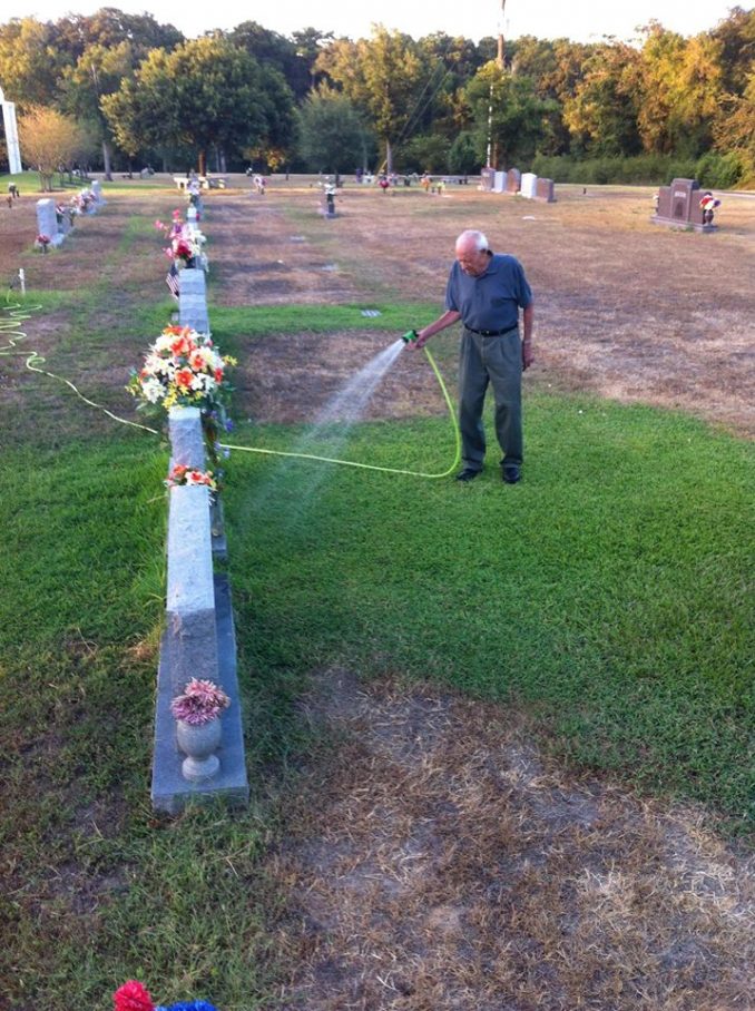 Roger Reissig Waters The Grass At His Wife's Grave