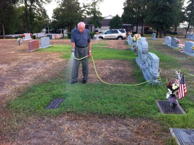 Roger Reissig Waters The Grass At His Wife's Grave