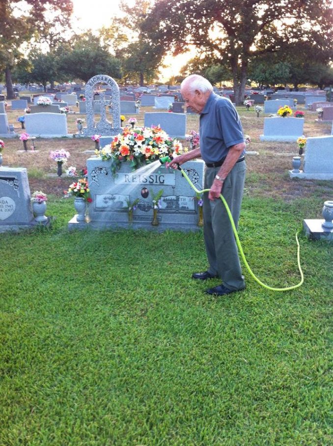 Roger Reissig Waters The Grass At His Wife's Grave