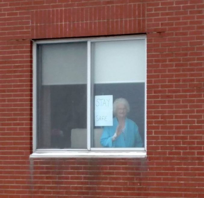 Gloria Porter Puts Sign On Hospital Window For Ironworker