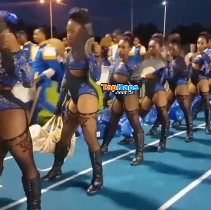 Cheerleaders from a high school in Miami strut onto the football field wearing lingerie costumes