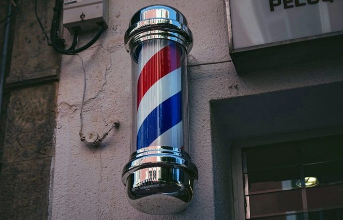 After sitting down to receive a standard trim from Abdulrahim Omar, a boy was shocked when he looked in the mirror and saw the final product.