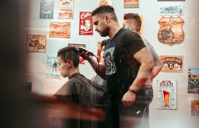 After sitting down to receive a standard trim from Abdulrahim Omar, a boy was shocked when he looked in the mirror and saw the final product.